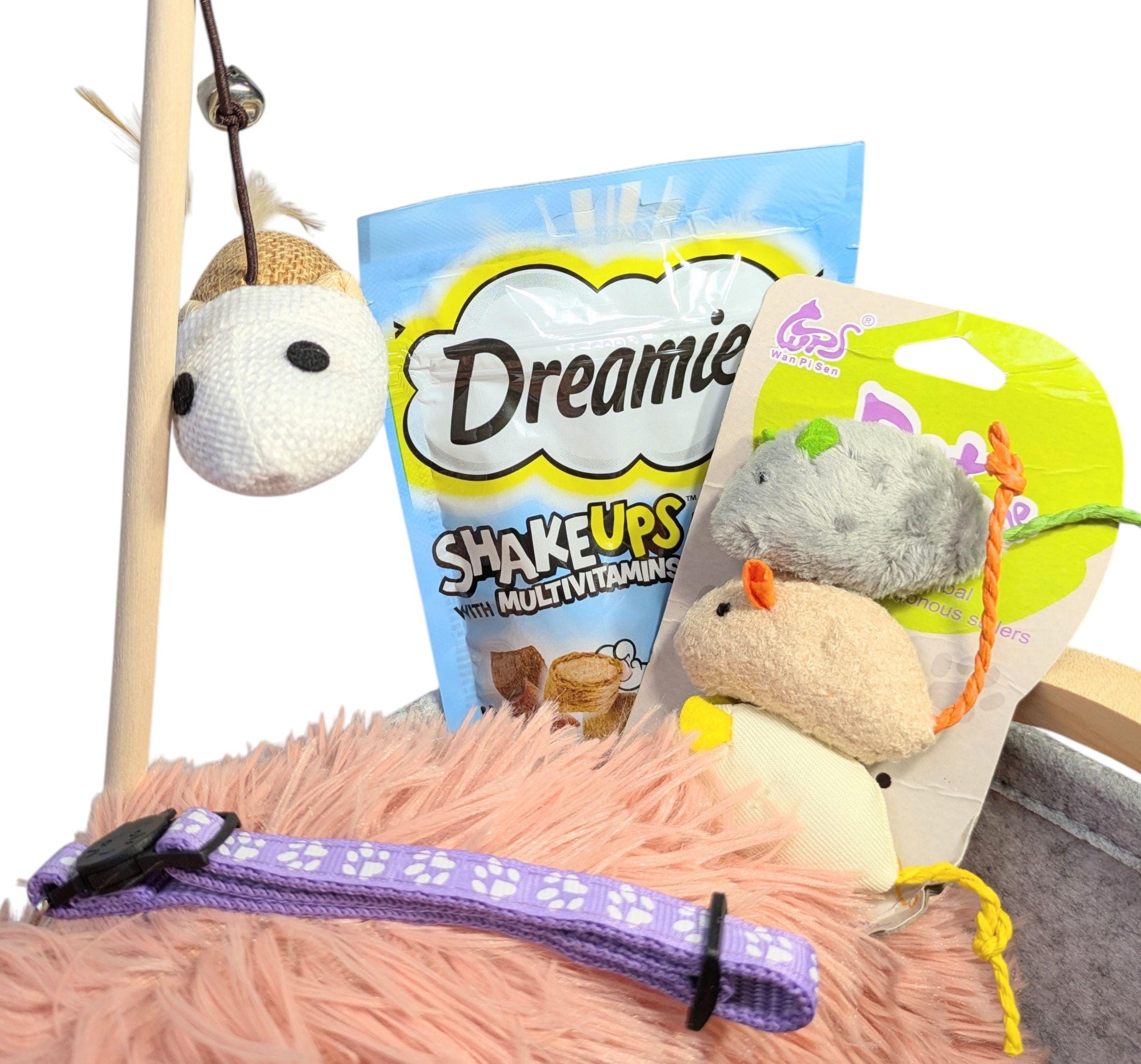 Soft pink cat bed with purple collar, wooden wand toy with mouse, plush mouse and cat treats pack.