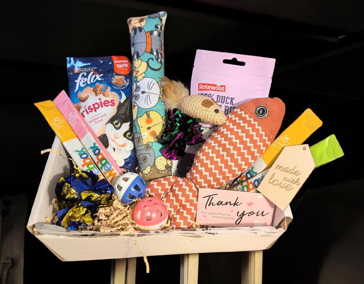 Large cat treat box with colorful toys, catnip pillow, snacks, and a thank you card.