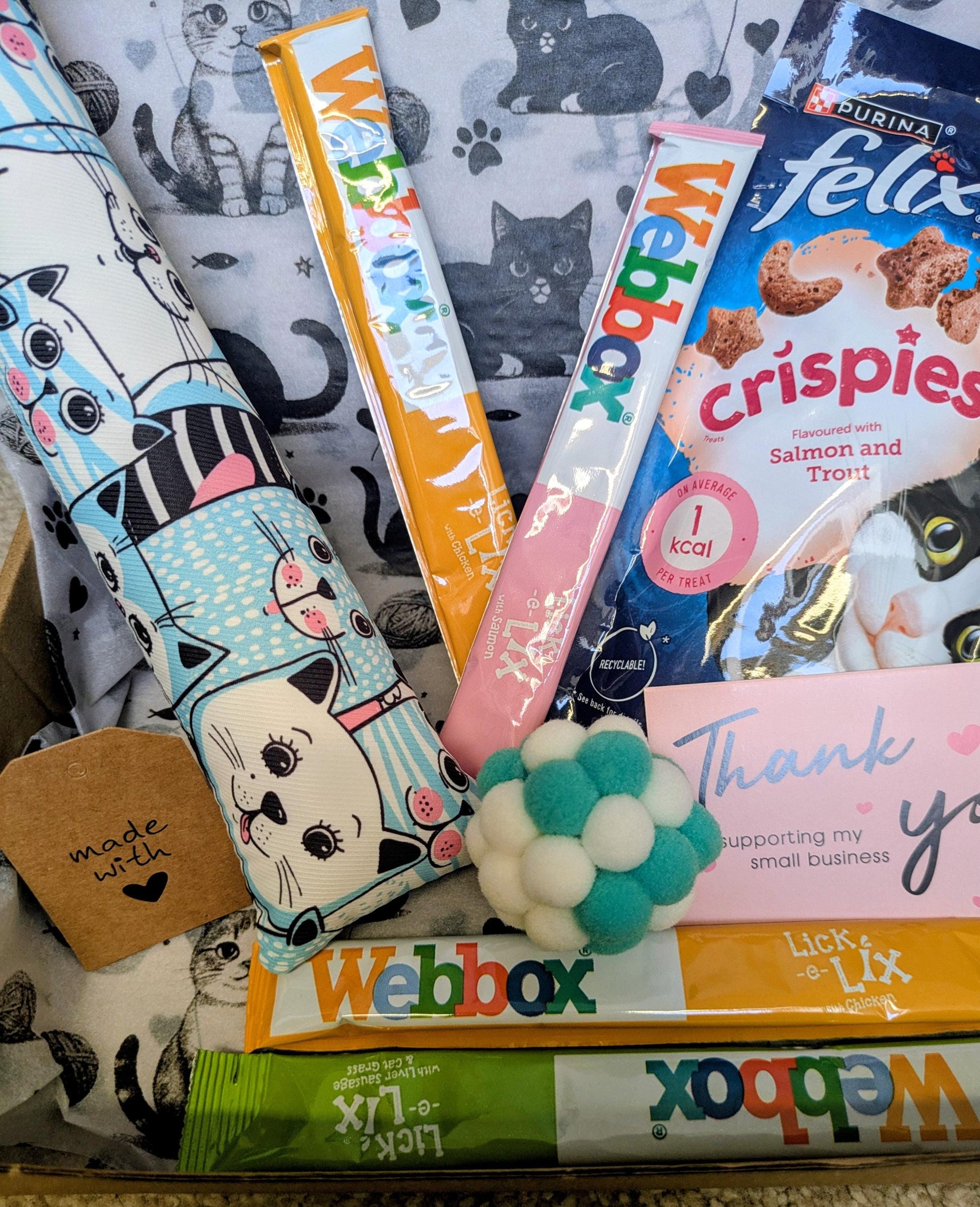 Personalised cat treat box with Felix cat treats, colorful Webbox sticks, catnip kicker toy, and thank you card on.