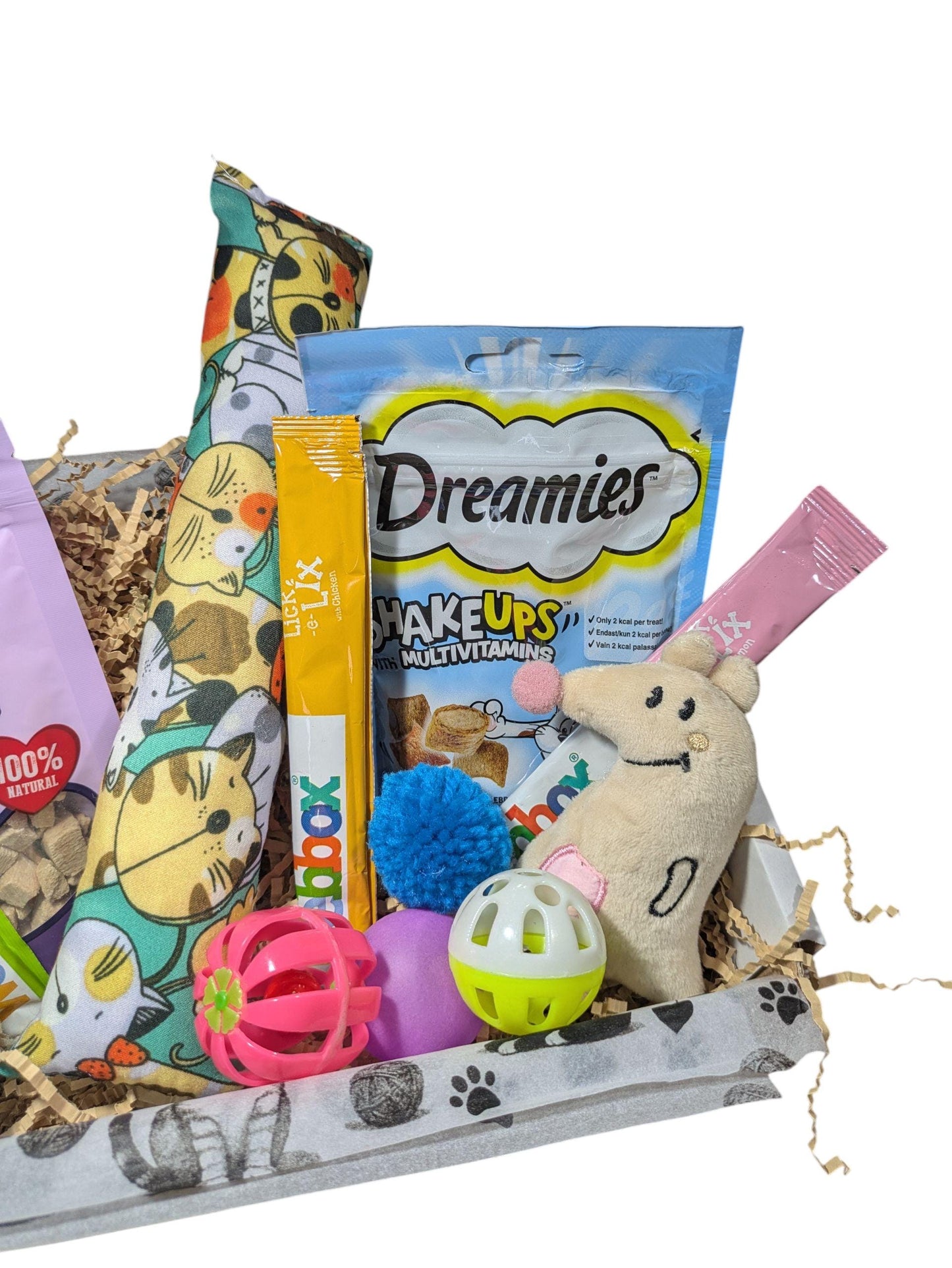 Personalised cat treat box with colourful catnip pillow, Dreamies treat bag, various cat toys including balls and plush.